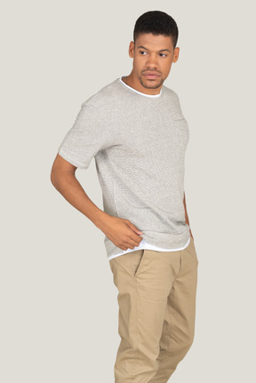 Athletic man posing on the grey background
