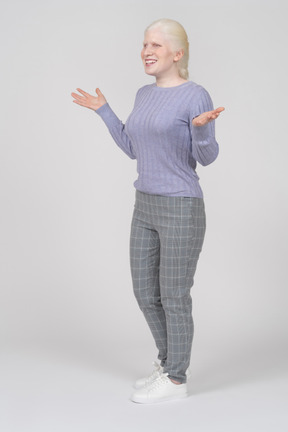 Young woman spreading arms and smiling