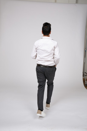 Man in white shirt standing