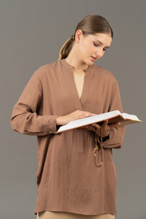 Young woman holding a book