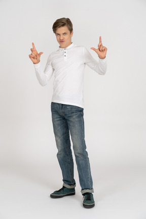Young man in casual clothes standing