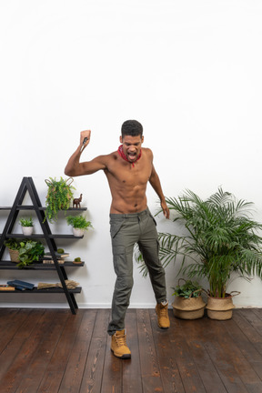 Good looking muscular man with a knife