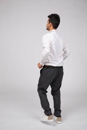 Man in white shirt standing