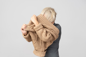 I'm trapped in my own sweater