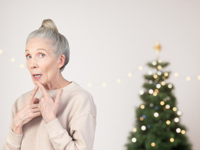 Old woman thinking about gifts from santa